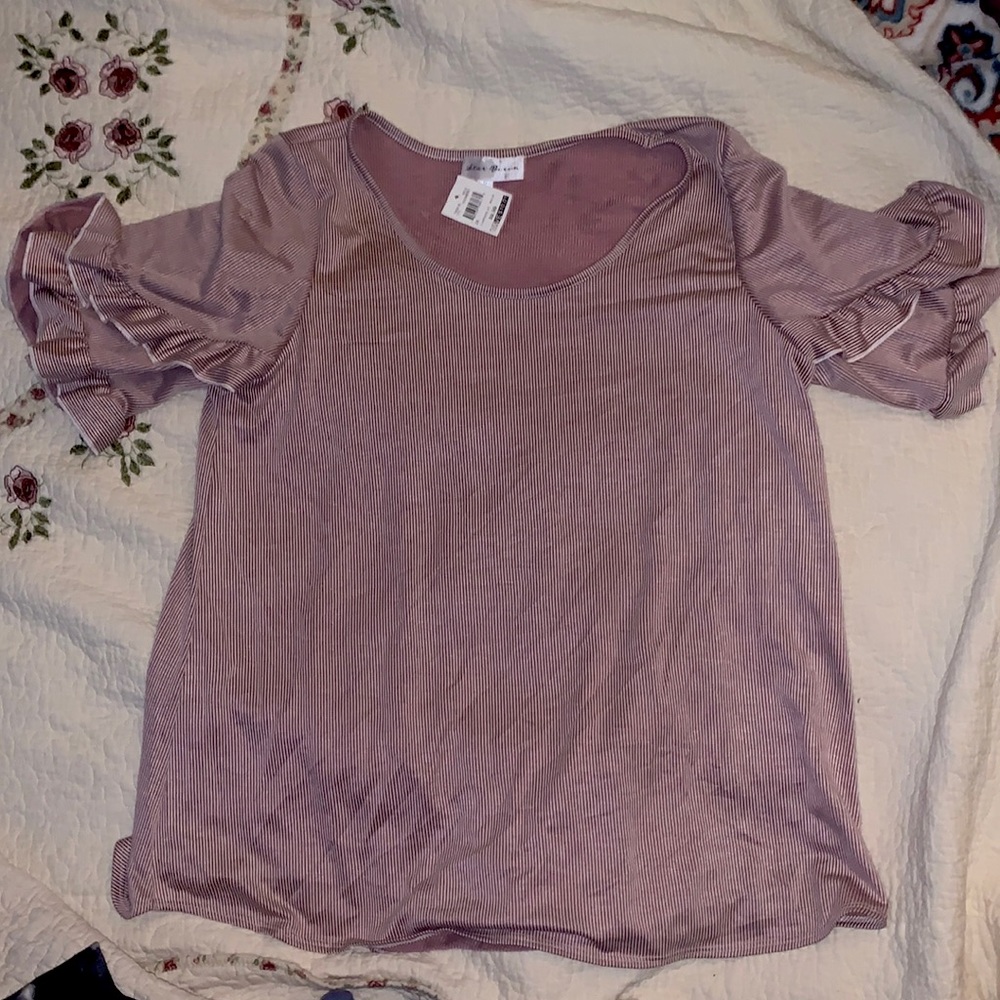 It’s a ruffle sleeve blouse